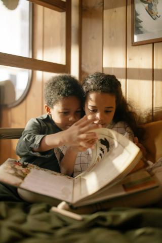 Two Kids Reading a Book